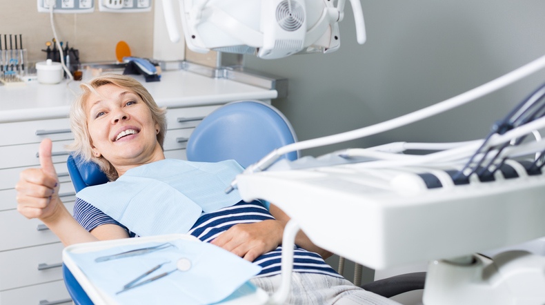 Patient giving thumbs up during a safe sedation dentistry at Modern Touch Dental Glendale.